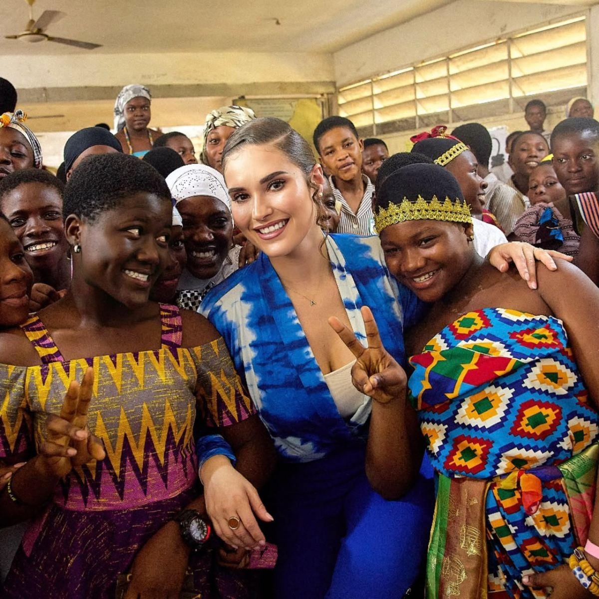 Shalimar Abbiusi with a group of women, arms around one another, smiling