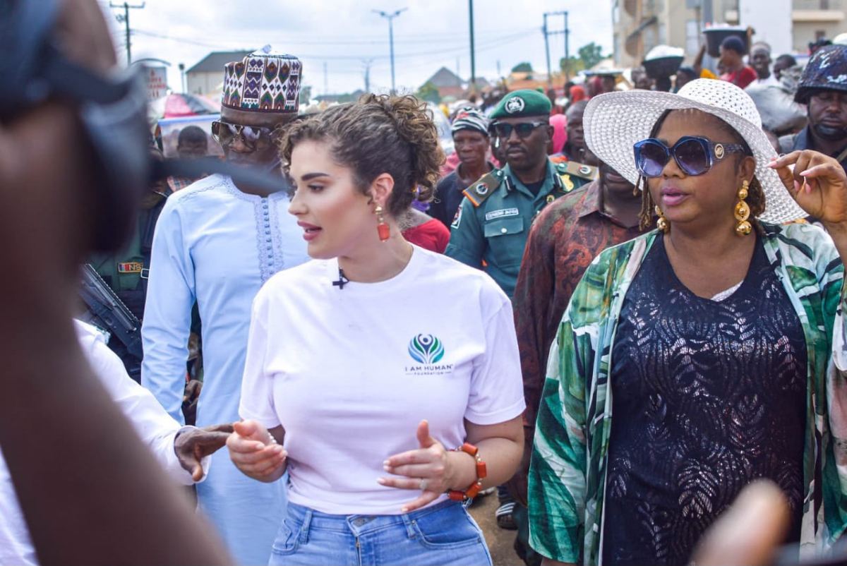Shalimar Abbiusi walking through a market with community members