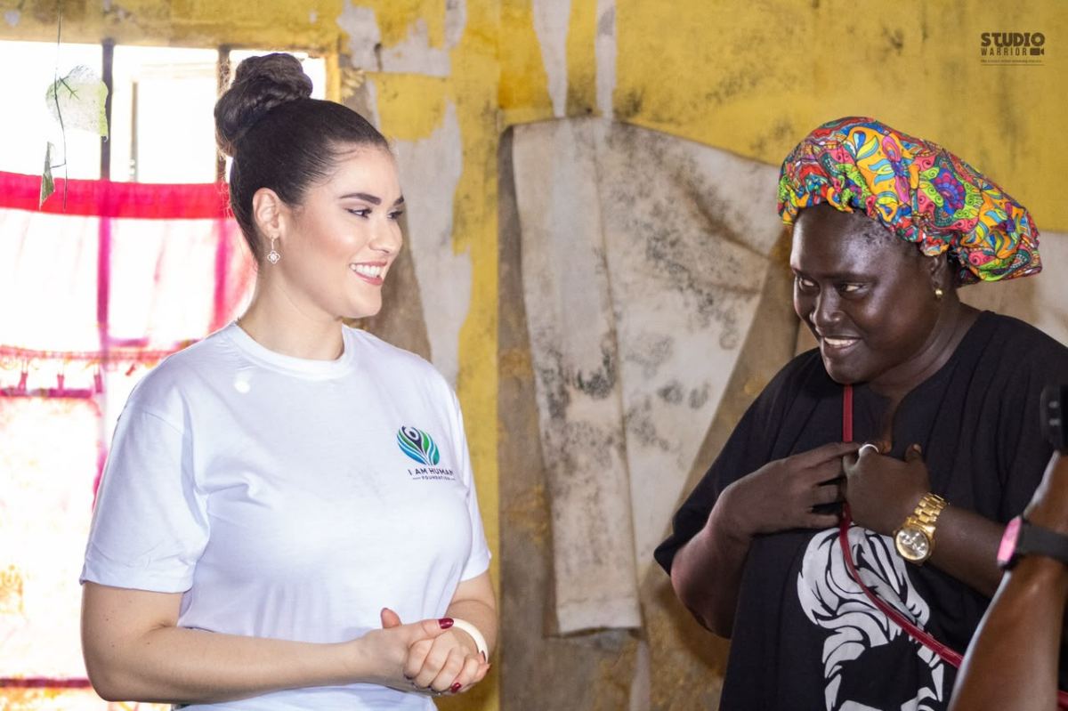 Shalimar Abbiusi greeting an elderly woman
